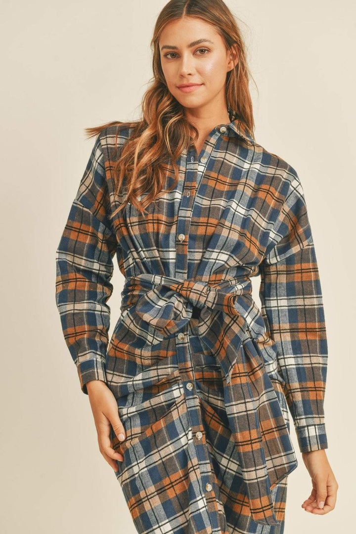 Plaid Flannel Shirt DressThis cotton and chenille shirt dress features a classic plaid flannel pattern in a versatile and stylish design. With a front tie detail, it adds a touch of femininiMidi DressesPlaid Flannel Shirt