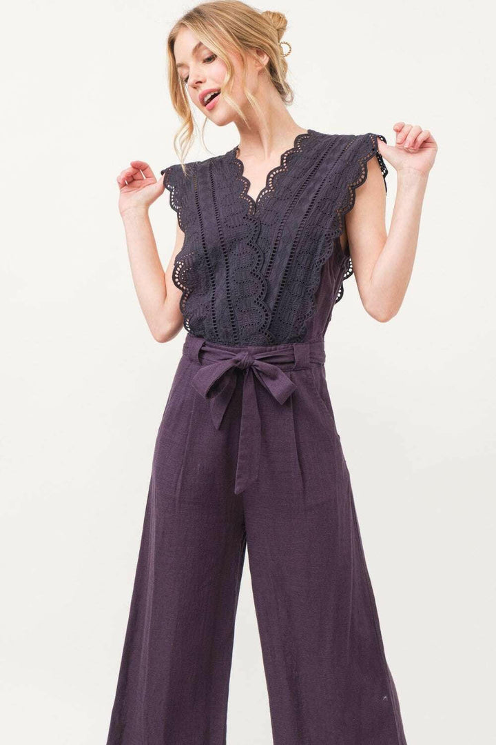 Plum Elegance Lace JumpsuitThe Plum Elegance Lace Jumpsuit is a chic and sophisticated piece that combines elegance with modern style. Featuring a laced surplice neckline and a flattering tie JumpsuitsPlum Elegance Lace Jumpsuit