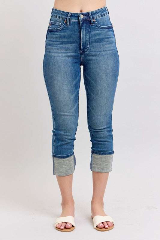 Judy Blue Skinny Cuff Capris JeansSkinny cuff capris jeans are a trendy style of jeans that are fitted through the legs and end in a cuffed hem. They are a great option for a casual and chic look, peCropped JeansJudy Blue Skinny Cuff Capris Jeans