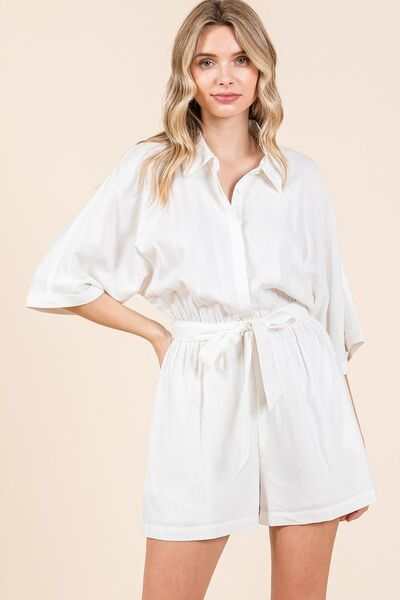 Tie Waist Linen Blend Half Sleeve RomperThe Tie Waist Linen Blend Half Sleeve Romper is a stylish and versatile one-piece outfit that exudes casual elegance. With a tie waist detail and half sleeves, this RompersTie Waist Linen Blend