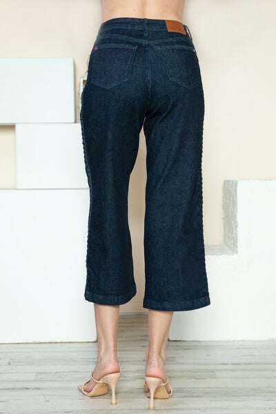 Judy Blue Side Seam Braid Detail Crop Wide Leg JeansThe High Rise side seam braid detail crop wide leg jeans offer a contemporary twist on classic denim. Featuring a unique braided detail along the side seams, these jCropped JeansJudy Blue Side Seam