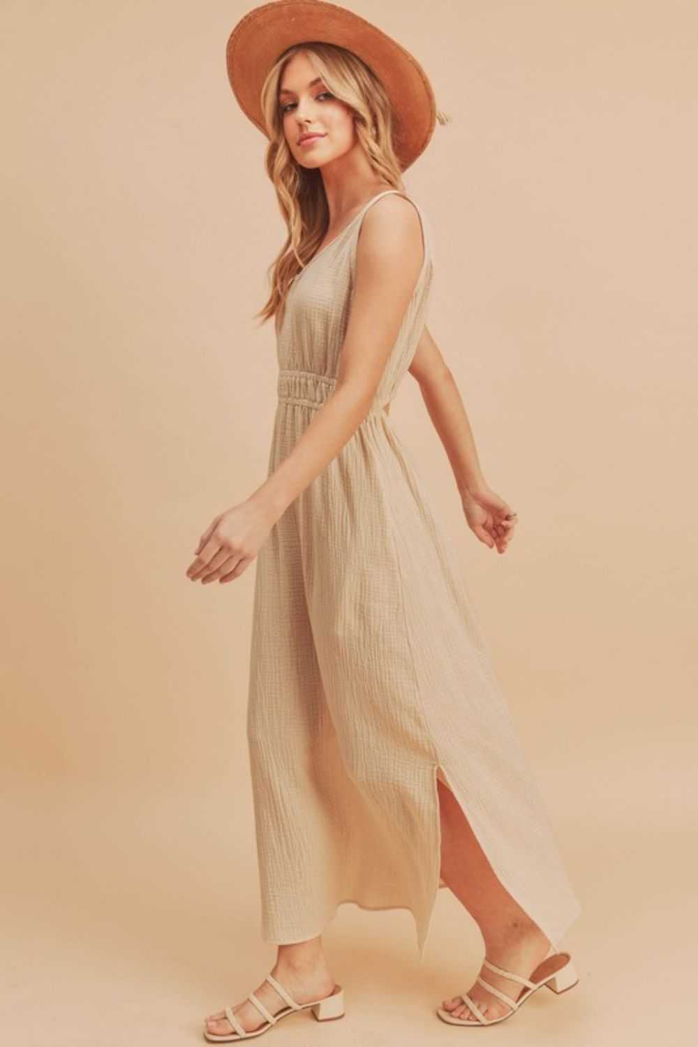 The Textured Cotton Midi Tank DressLight, breathable, and softly structured, The Textured Midi Tank Dress is crafted from a gently textured cotton that moves with ease. The sleeveless tank silhouette Midi DressesThe Textured Cotton Midi Tank Dress