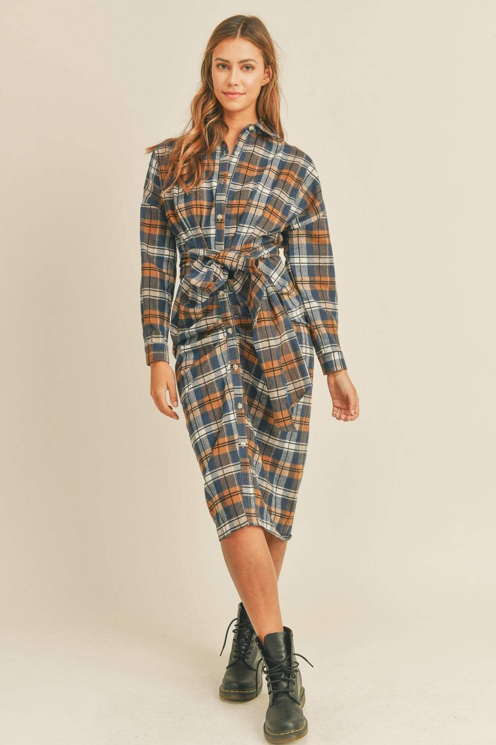 Plaid Flannel Shirt DressThis cotton and chenille shirt dress features a classic plaid flannel pattern in a versatile and stylish design. With a front tie detail, it adds a touch of femininiMidi DressesPlaid Flannel Shirt