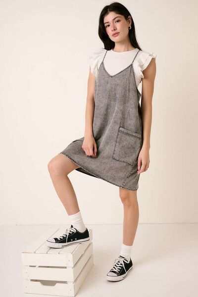 Washed Patch Pocket Mini Cami Denim DressThis washed patch pocket mini cami denim dress is a casual yet stylish addition to your wardrobe. The patch pockets add a touch of functionality and detail, while thMini DressesWashed Patch Pocket Mini Cami Denim Dress