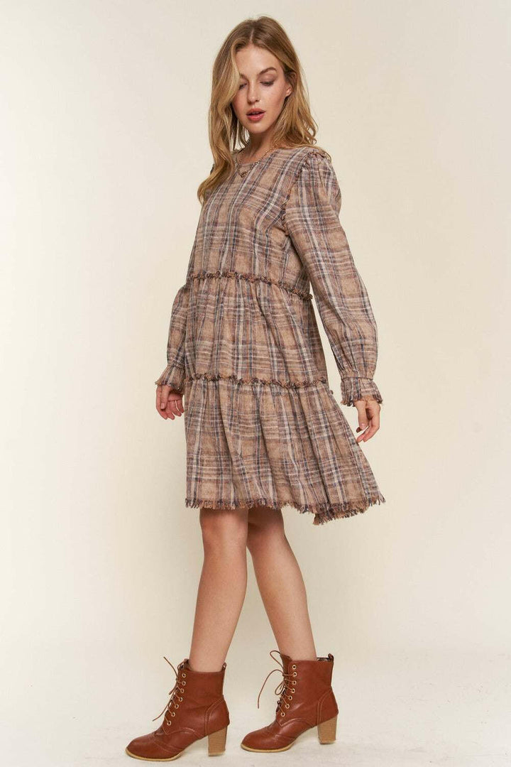Tiered Plaid DressThe Tiered Plaid Dress is a charming and stylish addition to your wardrobe. With its unique tiered design and frayed detailing, this dress exudes a trendy and bohemiMini DressesTiered Plaid Dress