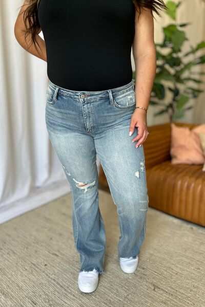 Judy Blue Medium Rise Tummy Control Destroyed FlareThe medium rise tummy control destroy flare jeans are designed to enhance your silhouette while providing ultimate comfort. Featuring a flattering fit, these jeans oFlare JeansJudy Blue Medium Rise