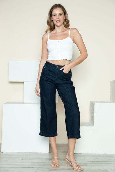 Judy Blue Side Seam Braid Detail Crop Wide Leg JeansThe High Rise side seam braid detail crop wide leg jeans offer a contemporary twist on classic denim. Featuring a unique braided detail along the side seams, these jCropped JeansJudy Blue Side Seam