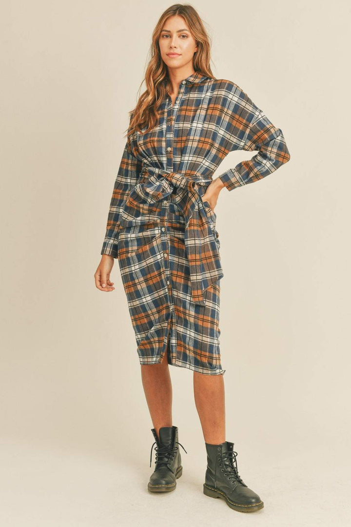 Plaid Flannel Shirt DressThis cotton and chenille shirt dress features a classic plaid flannel pattern in a versatile and stylish design. With a front tie detail, it adds a touch of femininiMidi DressesPlaid Flannel Shirt