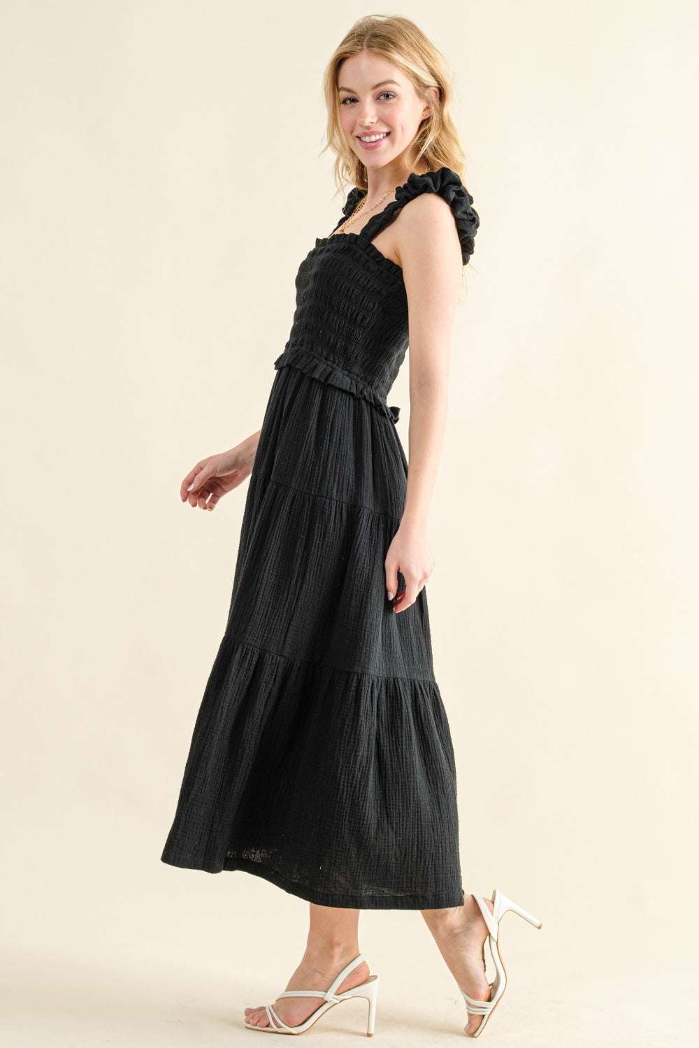 Smocked Ruffled Tiered DressThe Smocked Ruffled Tiered Dress is a charming and feminine 100% cotton piece that exudes effortless style. The smocked bodice provides a comfortable and flattering Midi DressesSmocked Ruffled Tiered Dress