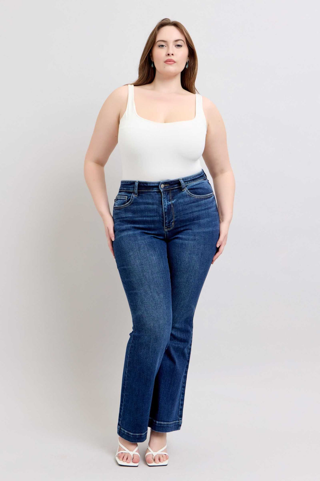 Judy Blue High Rise Flare Jeans with PocketsHigh-rise flare jeans with pockets are a trendy and versatile wardrobe staple. They provide a flattering high-waisted silhouette and the flare leg adds a chic retro Flare JeansJudy Blue High Rise Flare Jeans