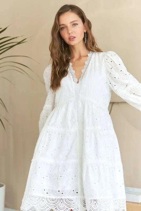 Lace Detail Tiered Eyelet V-Neck Babydoll DressA Lace Detail Tiered Eyelet V-Neck Babydoll Dress is a charming and elegant piece for your wardrobe. The V-neckline and babydoll silhouette offer a flattering and feMini DressesLace Detail Tiered
