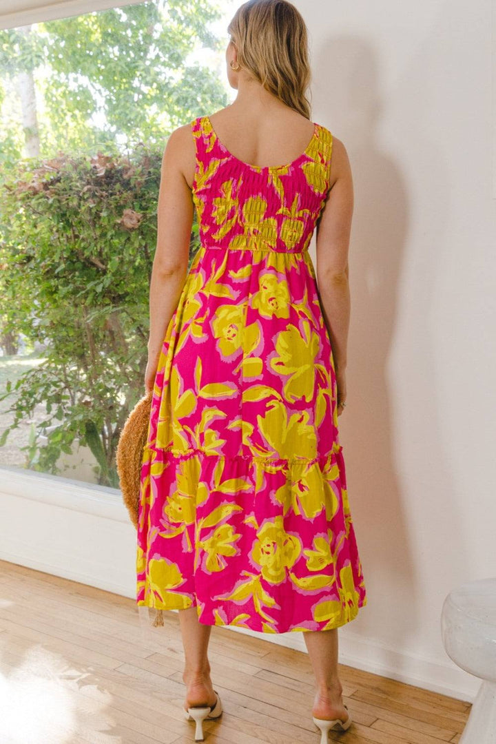 Sunset Bloom Midi DressThe Sunset Bloom Midi Dress is a delightful and feminine choice that radiates elegance and charm. With its beautiful floral print and dainty ruffled details, this drMidi DressesSunset Bloom Midi Dress
