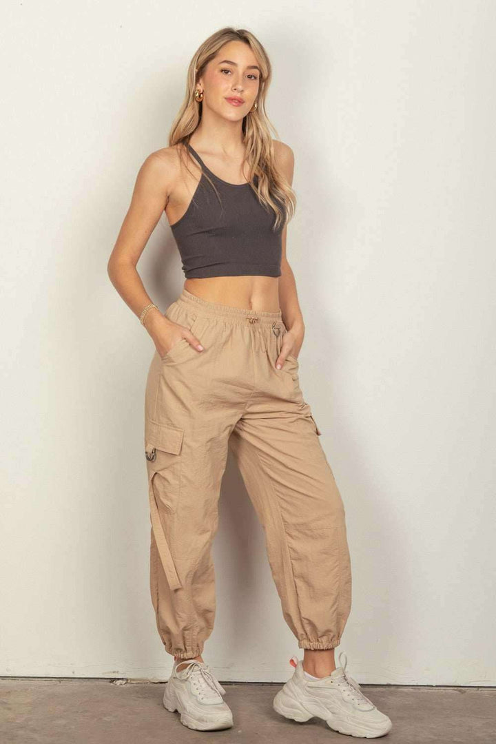 Desert Cargo JoggersStay on-trend with these Y2K-inspired elastic waist solid cargo joggers featuring a utility design perfect for everyday wear. The side pockets and D rings add a toucPantsDesert Cargo Joggers
