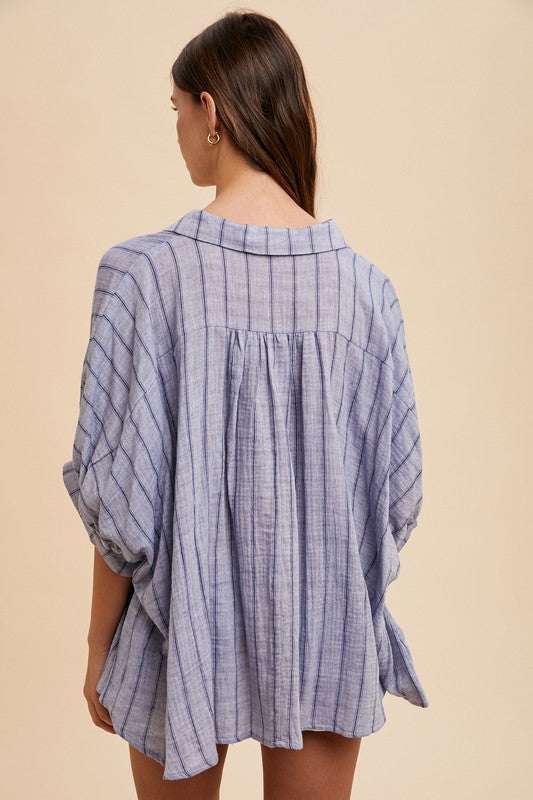 Coastal Breeze Oversized ShirtA striped button-up half sleeve shirt is a fashionable and versatile piece that can be worn in various settings. This type of shirt typically features a classic buttButton-Up ShirtsCoastal Breeze Oversized Shirt