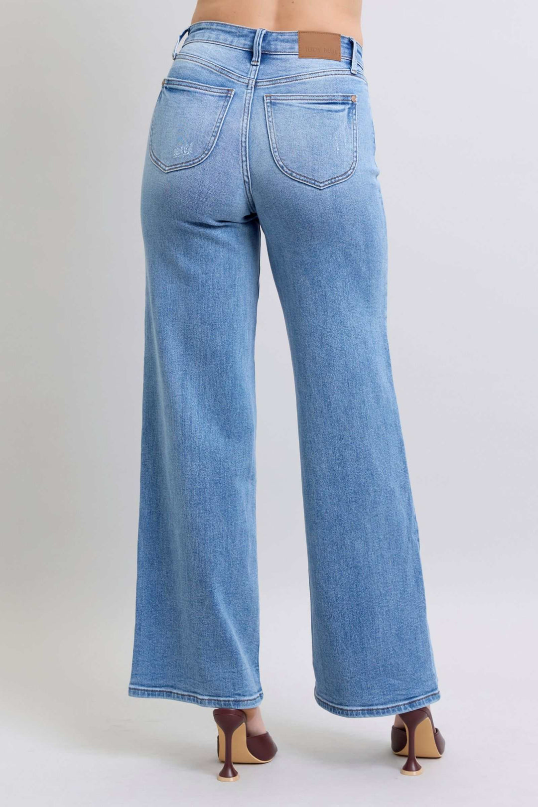 Judy Blue Wide Leg Jeans with PocketsWide Leg Jeans with Pockets are a trendy and versatile option for those looking to make a statement with their outfit. The wide-leg silhouette offers a relaxed and vWide Leg JeansJudy Blue Wide Leg Jeans