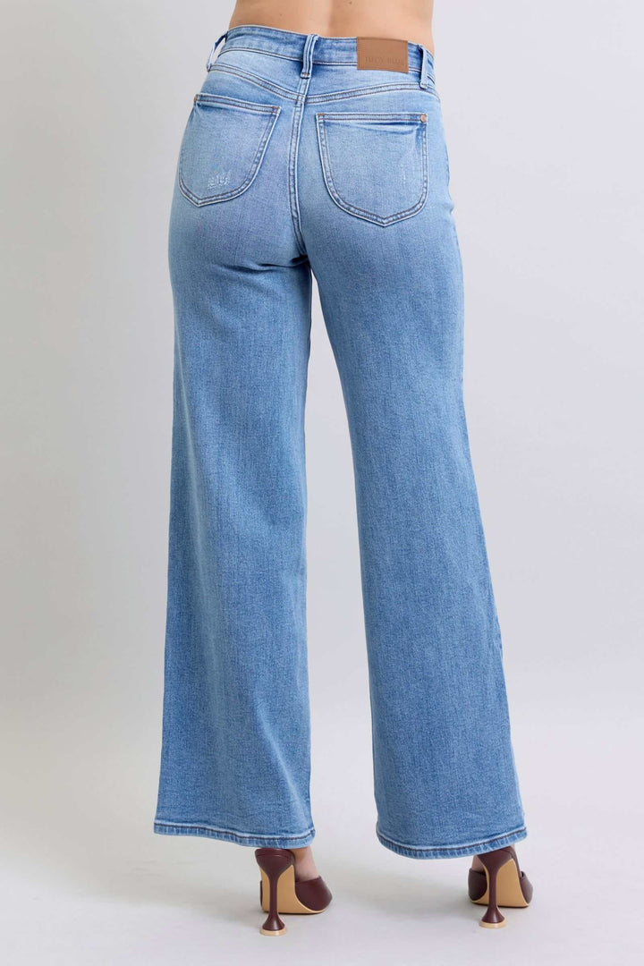 Judy Blue Wide Leg Jeans with PocketsWide Leg Jeans with Pockets are a trendy and versatile option for those looking to make a statement with their outfit. The wide-leg silhouette offers a relaxed and vWide Leg JeansJudy Blue Wide Leg Jeans
