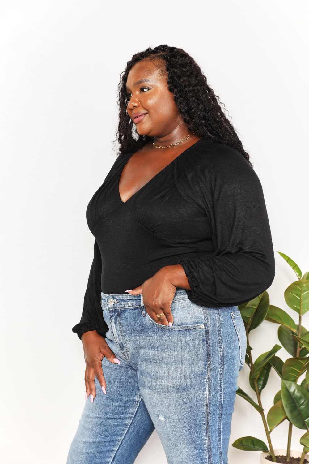 V- Neck Long Sleeve BodysuitThis bodysuit seamlessly merges romantic allure with contemporary flair. The poet sleeves, with their billowing and slightly puffed structure, infuse a sense of dramBodysuitsV- Neck Long Sleeve Bodysuit