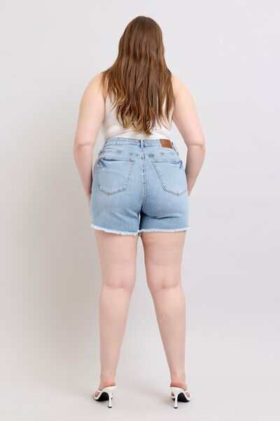 Judy Blue Tummy Control Raw Hem Denim ShortsThe tummy control raw hem denim shorts are designed to provide a slimming effect around the waist area while also featuring a trendy raw hem finish at the bottom. ThJean ShortsJudy Blue Tummy Control