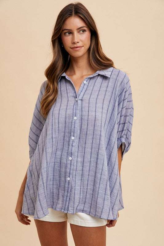 Coastal Breeze Oversized ShirtA striped button-up half sleeve shirt is a fashionable and versatile piece that can be worn in various settings. This type of shirt typically features a classic buttButton-Up ShirtsCoastal Breeze Oversized Shirt