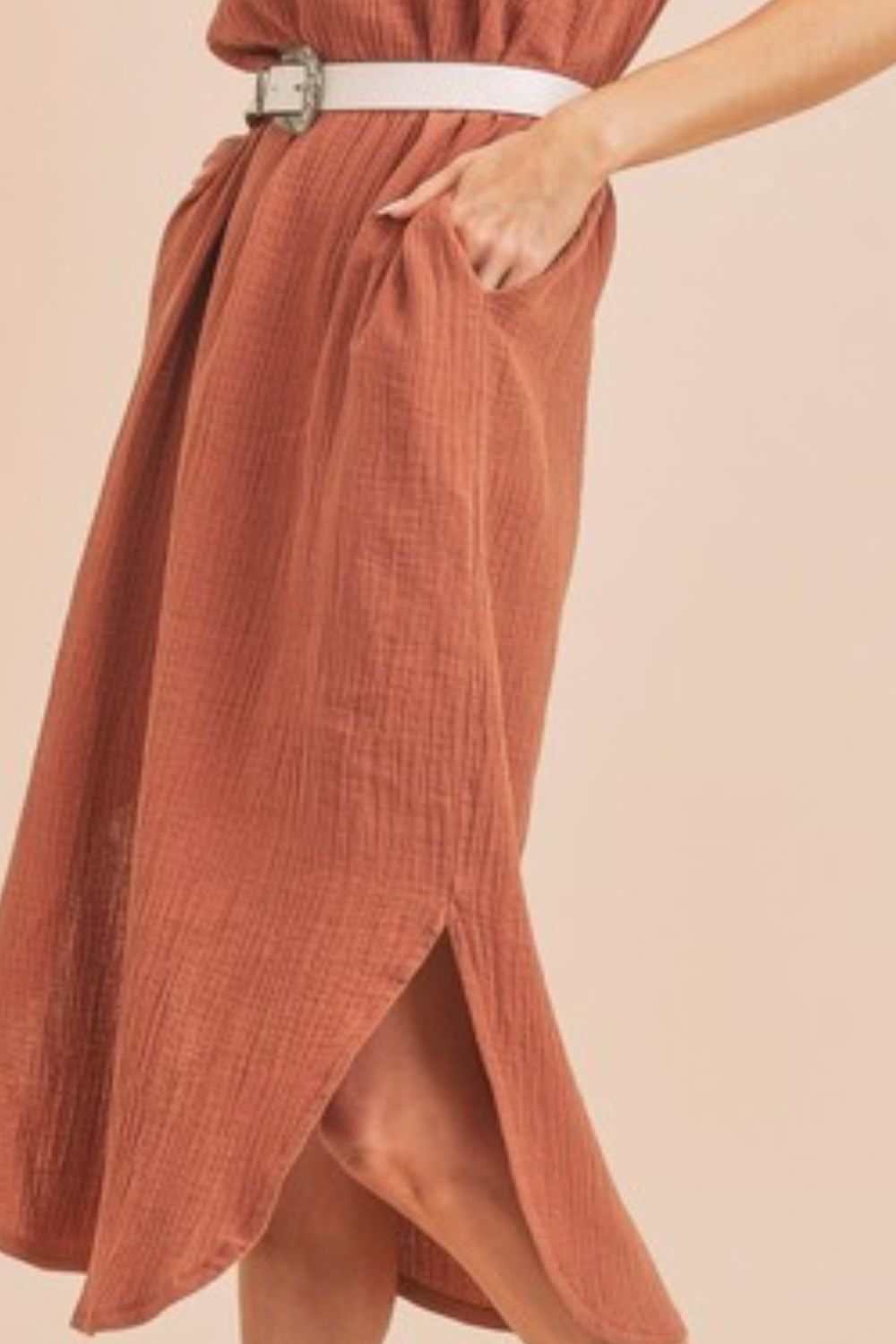 Textured Cotton Midi Tank Dress with PocketsA round neck midi tank dress with pockets is a sleeveless dress that features a round neckline and practical pockets on the dress. This type of dress is casual and cMidi DressesTextured Cotton Midi