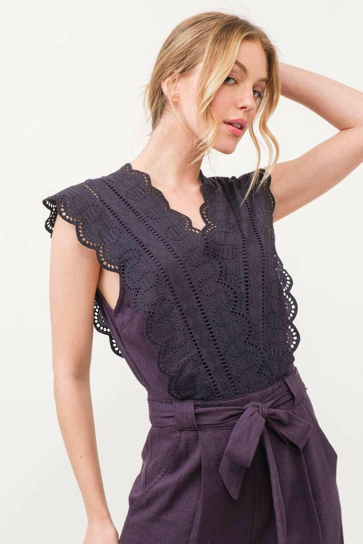 Plum Elegance Lace JumpsuitThe Plum Elegance Lace Jumpsuit is a chic and sophisticated piece that combines elegance with modern style. Featuring a laced surplice neckline and a flattering tie JumpsuitsPlum Elegance Lace Jumpsuit