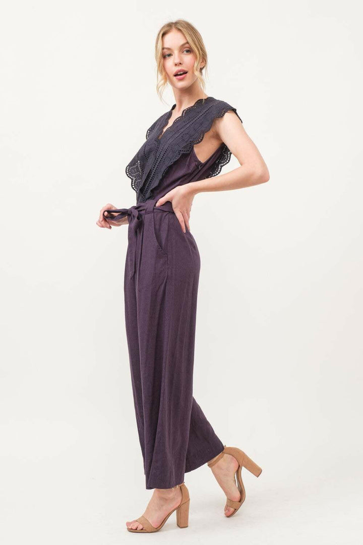 Plum Elegance Lace JumpsuitThe Plum Elegance Lace Jumpsuit is a chic and sophisticated piece that combines elegance with modern style. Featuring a laced surplice neckline and a flattering tie JumpsuitsPlum Elegance Lace Jumpsuit