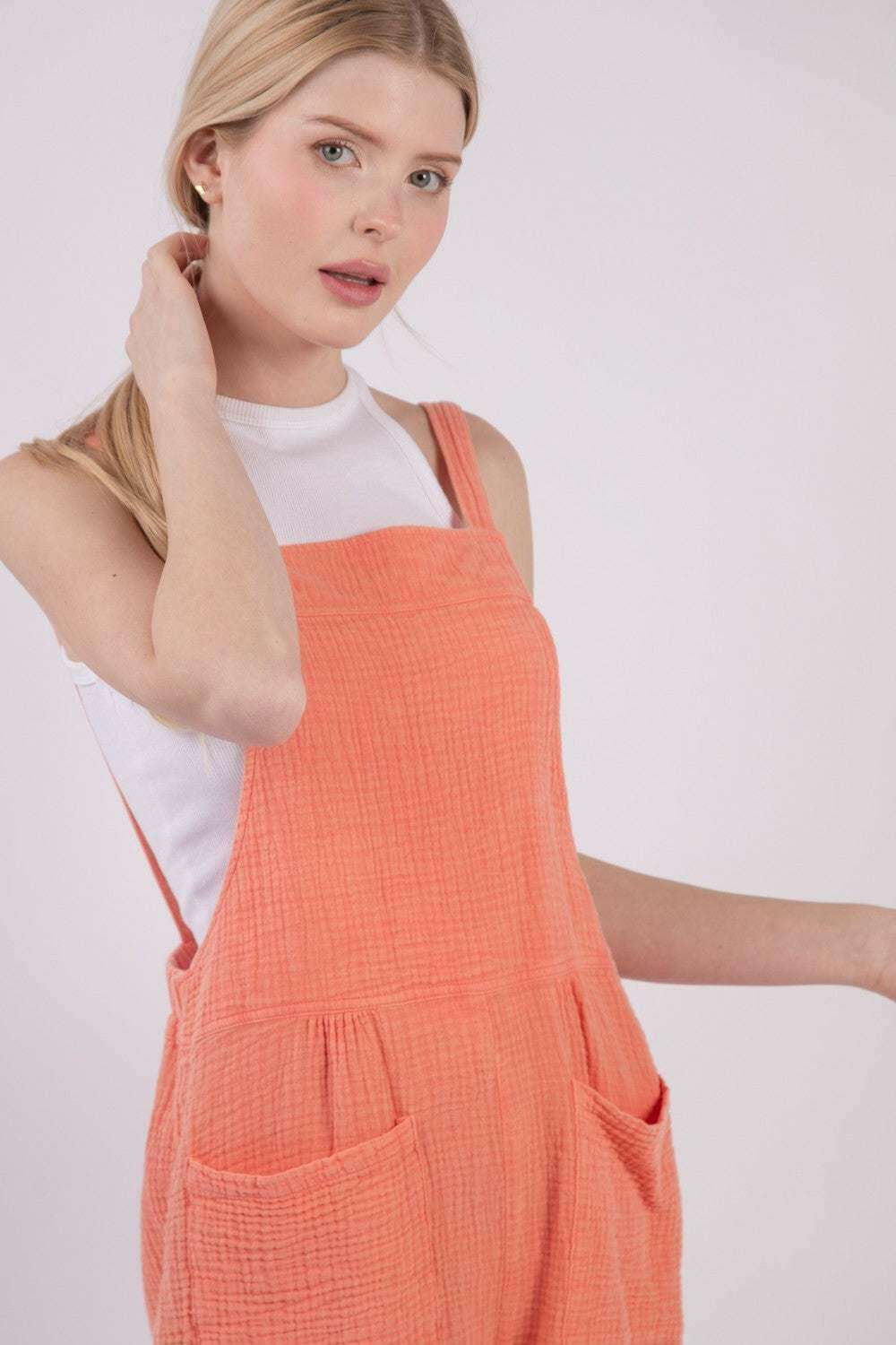 Sunny Coral Double Gauze Overall ShortsKeep cool and comfy with these overall shorts made from summer-friendly double gauze cotton. With a square neckline and open back, these overall shorts adds a stylisOverallsSunny Coral Double Gauze