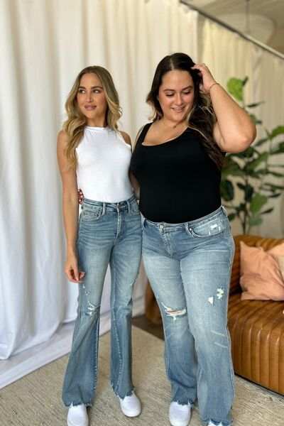 Judy Blue Medium Rise Tummy Control Destroyed FlareThe medium rise tummy control destroy flare jeans are designed to enhance your silhouette while providing ultimate comfort. Featuring a flattering fit, these jeans oFlare JeansJudy Blue Medium Rise