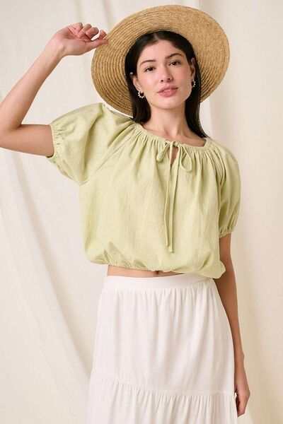 Cotton Two-Way Short Sleeve Cropped BlouseThe Cotton Two-Way Short Sleeve Crop Blouse is a versatile and chic piece that offers multiple styling options. Made from lightweight cotton fabric, this blouse is pShort Sleeve BlousesCotton Two-Way Short Sleeve