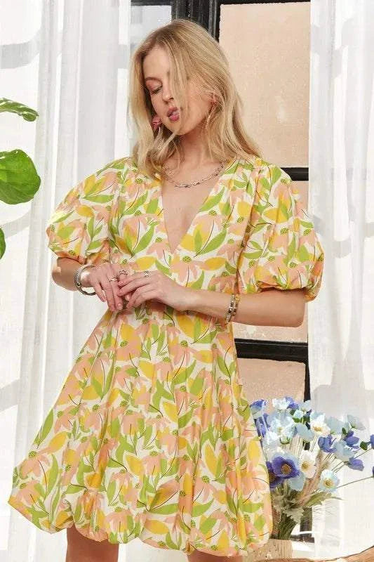 The Sunlit Petal DressSoft and luminous, The Sunlit Petal Dress captures the lightness of a warm morning in full bloom. Featuring puff sleeves, a softly flared mini silhouette, and a vibrMini DressesThe Sunlit Petal Dress