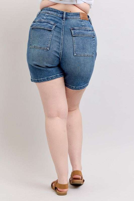 Judy Blue High Rise Denim ShortsHigh Rise Denim Shorts are a versatile and classic wardrobe staple that offer a stylish and flattering silhouette. These shorts sit at or above the natural waistlineJean ShortsJudy Blue High Rise Denim Shorts