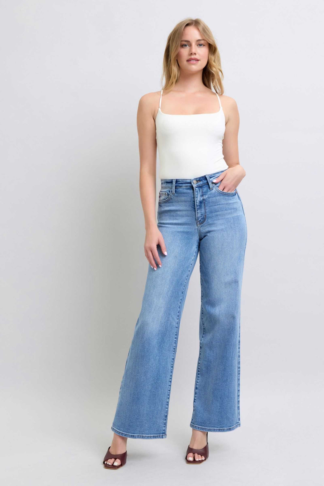 Judy Blue Wide Leg Jeans with PocketsWide Leg Jeans with Pockets are a trendy and versatile option for those looking to make a statement with their outfit. The wide-leg silhouette offers a relaxed and vWide Leg JeansJudy Blue Wide Leg Jeans