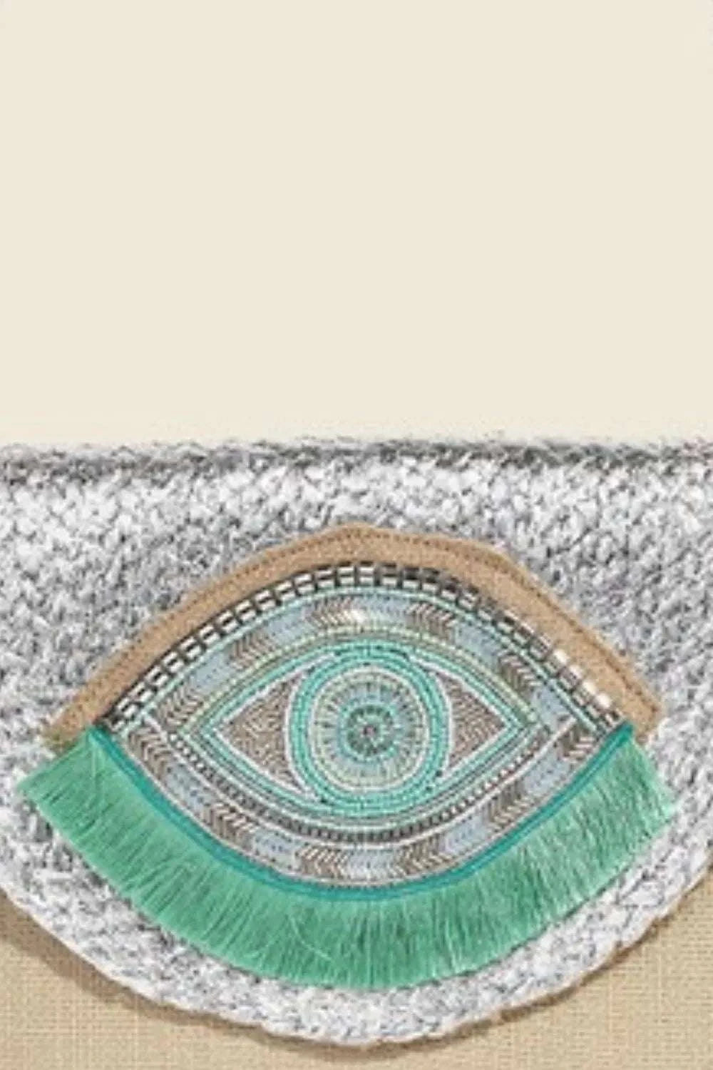 Fame Boho Beaded Eye Pattern Envelope BagThis boho beaded eye pattern envelope bag is a unique and artistic accessory that adds a touch of bohemian charm to any outfit. The intricate beadwork and eye patterHandbagsFame Boho Beaded Eye Pattern