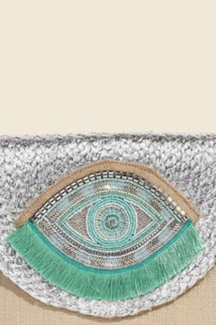 Fame Boho Beaded Eye Pattern Envelope BagThis boho beaded eye pattern envelope bag is a unique and artistic accessory that adds a touch of bohemian charm to any outfit. The intricate beadwork and eye patterHandbagsFame Boho Beaded Eye Pattern