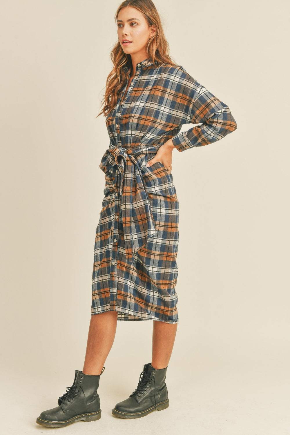 Plaid Flannel Shirt DressThis cotton and chenille shirt dress features a classic plaid flannel pattern in a versatile and stylish design. With a front tie detail, it adds a touch of femininiMidi DressesPlaid Flannel Shirt