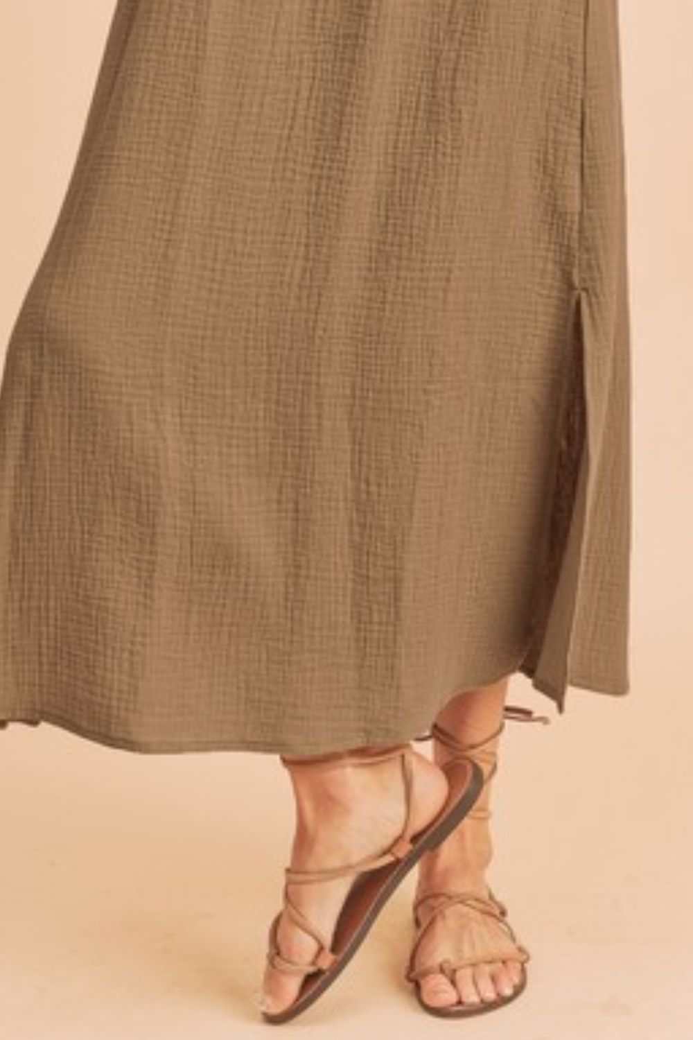 The Textured Cotton Midi Tank DressLight, breathable, and softly structured, The Textured Midi Tank Dress is crafted from a gently textured cotton that moves with ease. The sleeveless tank silhouette Midi DressesTextured Cotton Midi Tank