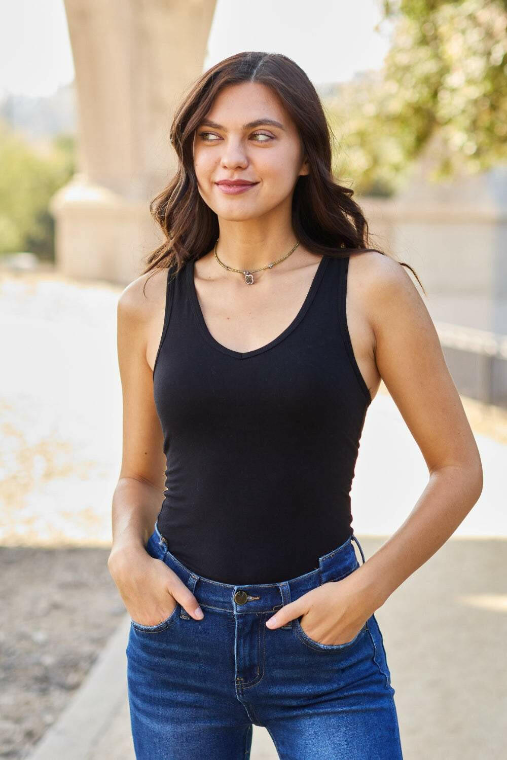 Racerback Tank BodysuitThis chic and flexible cotton blend bodysuit is meant to give you a perfect fit, hugging all the right curves. The racerback style adds a sporty flair, making it ideBodysuitsRacerback Tank Bodysuit