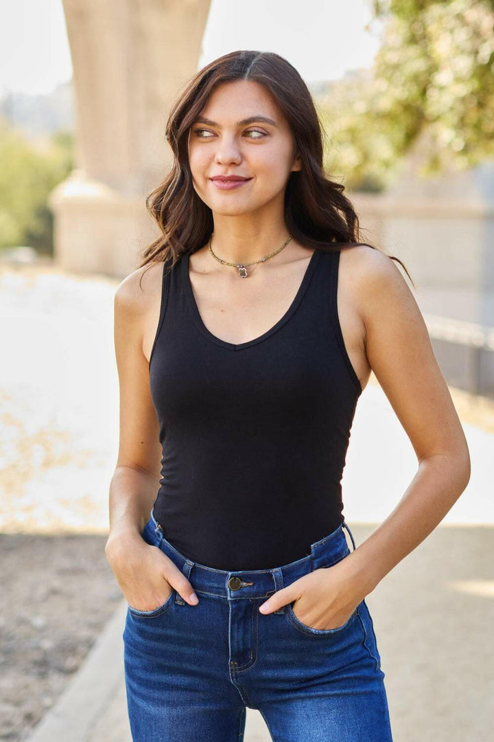 Racerback Tank BodysuitThis chic and flexible cotton blend bodysuit is meant to give you a perfect fit, hugging all the right curves. The racerback style adds a sporty flair, making it ideBodysuitsRacerback Tank Bodysuit