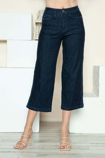 Judy Blue Side Seam Braid Detail Crop Wide Leg JeansThe High Rise side seam braid detail crop wide leg jeans offer a contemporary twist on classic denim. Featuring a unique braided detail along the side seams, these jCropped JeansJudy Blue Side Seam