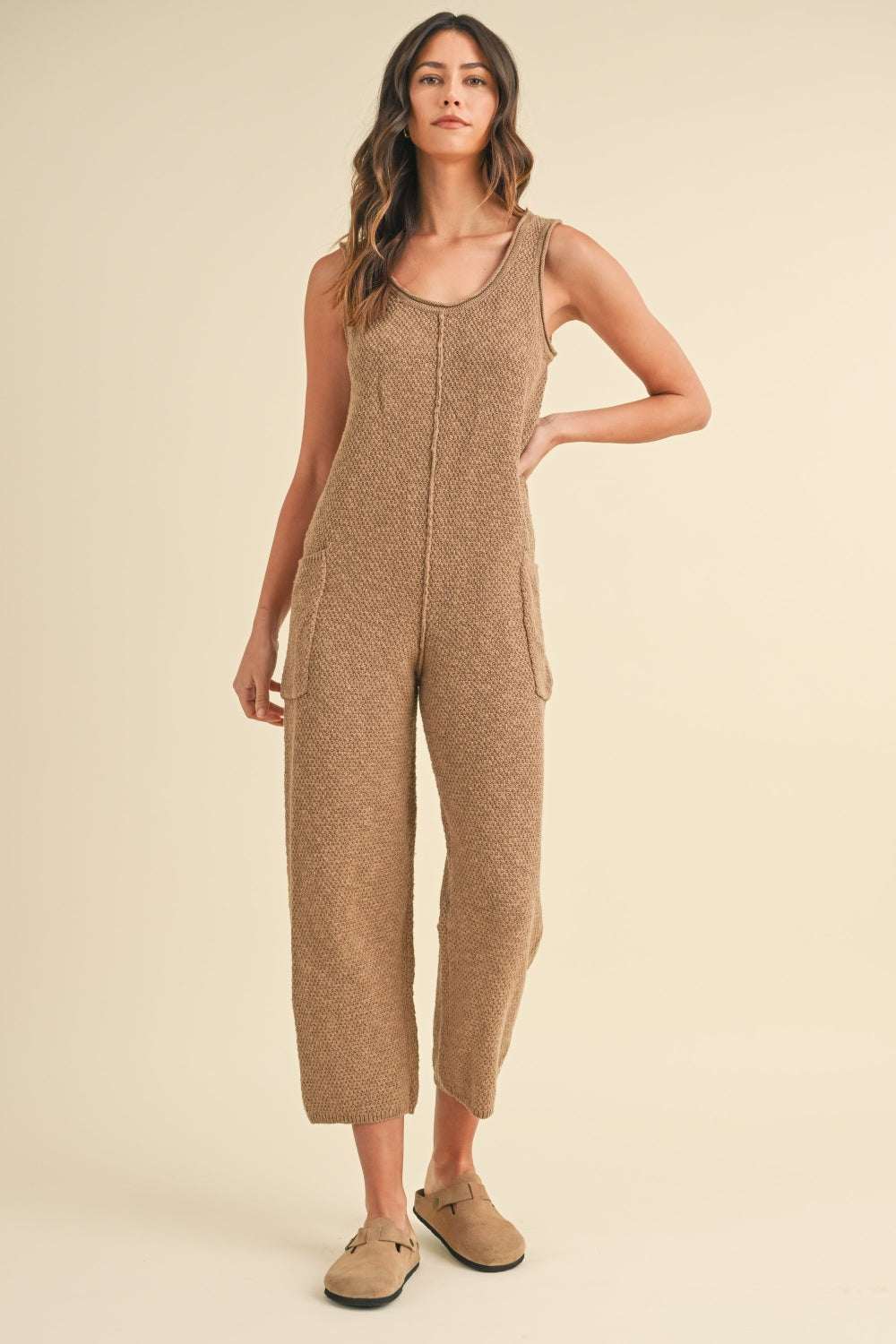 Cotton Knit JumpsuitThis sleeveless 100% cotton knit crop jumpsuit is crafted from a textured sweater knit material, offering both style and comfort. The side pocket detail adds functioJumpsuitsCotton Knit Jumpsuit