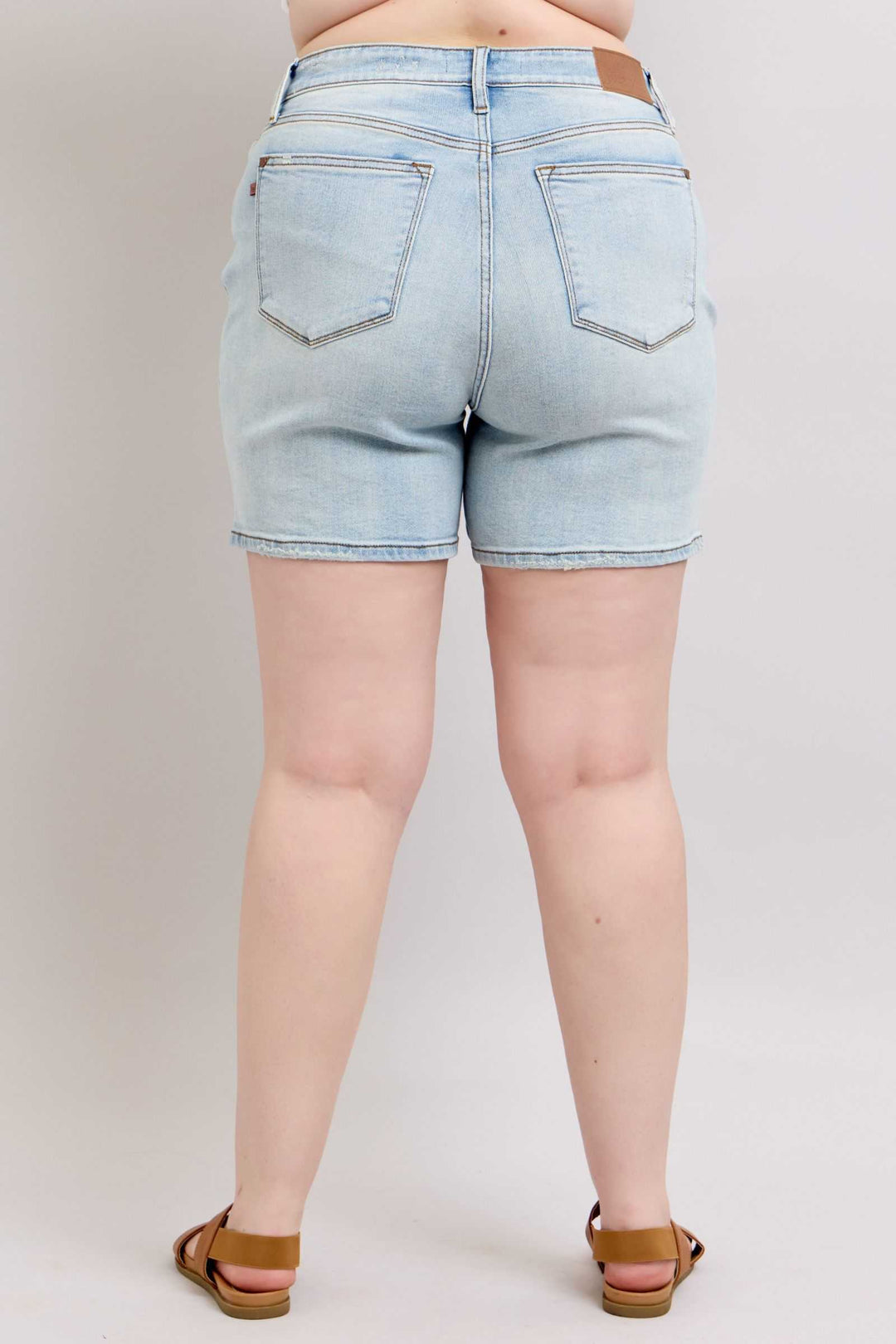 Judy Blue Two Button Denim ShortsThese 2-button denim shorts are a stylish addition to your wardrobe. They feature pockets for your convenience and added functionality. Made from durable denim fabriJean ShortsJudy Blue Two Button Denim Shorts