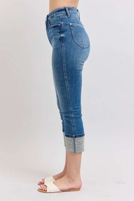 Judy Blue Skinny Cuff Capris JeansSkinny cuff capris jeans are a trendy style of jeans that are fitted through the legs and end in a cuffed hem. They are a great option for a casual and chic look, peCropped JeansJudy Blue Skinny Cuff Capris Jeans