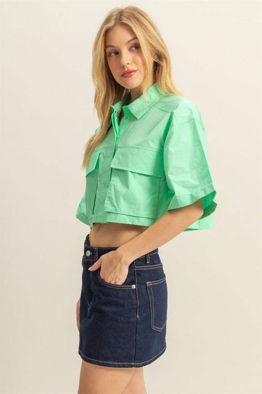 Cotton Poplin Cropped ShirtThe Cotton Poplin Cropped Shirt is a stylish and versatile piece that adds a modern twist to your wardrobe. This crop shirt features front pockets that add a utilitaCrop TopsCotton Poplin Cropped Shirt