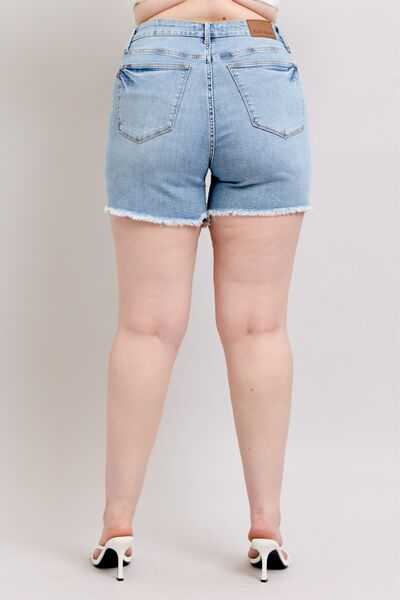 Judy Blue Tummy Control Raw Hem Denim ShortsThe tummy control raw hem denim shorts are designed to provide a slimming effect around the waist area while also featuring a trendy raw hem finish at the bottom. ThJean ShortsJudy Blue Tummy Control