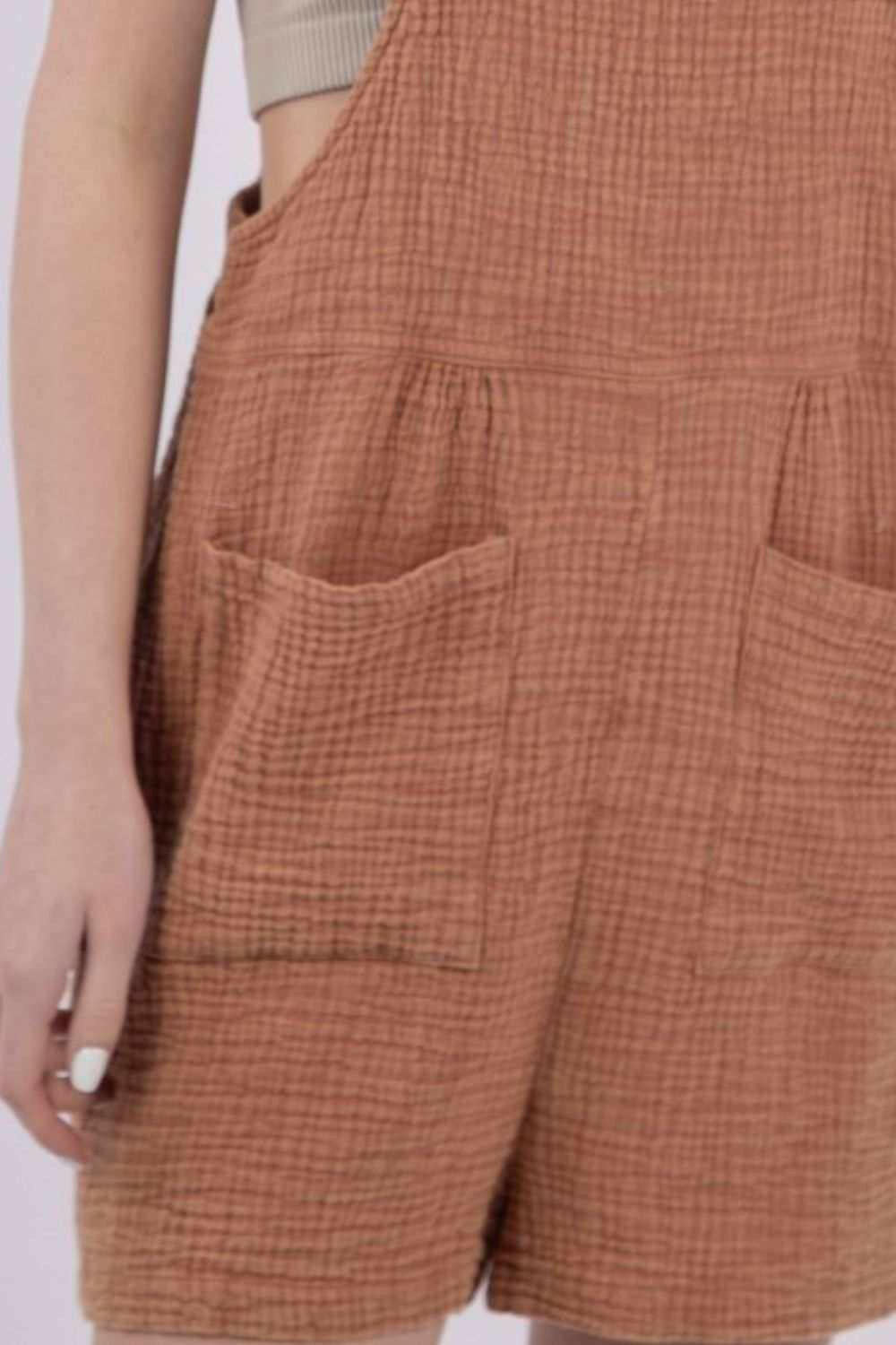 Burnt Sienna Double Gauze Overall ShortsKeep cool and comfy with these overall shorts made from summer-friendly double gauze cotton. With a square neckline and open back, these overall shorts adds a stylisOverallsBurnt Sienna Double Gauze