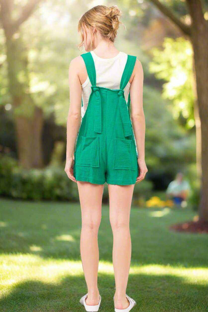 Button Up Tie Back Sleeveless RomperSpruce up your summer wardrobe with the And The Why Button Up Tie Back Sleeveless Romper! This must-have piece boasts a button-up front detail, a cute and adjustableRompersButton Up Tie Back