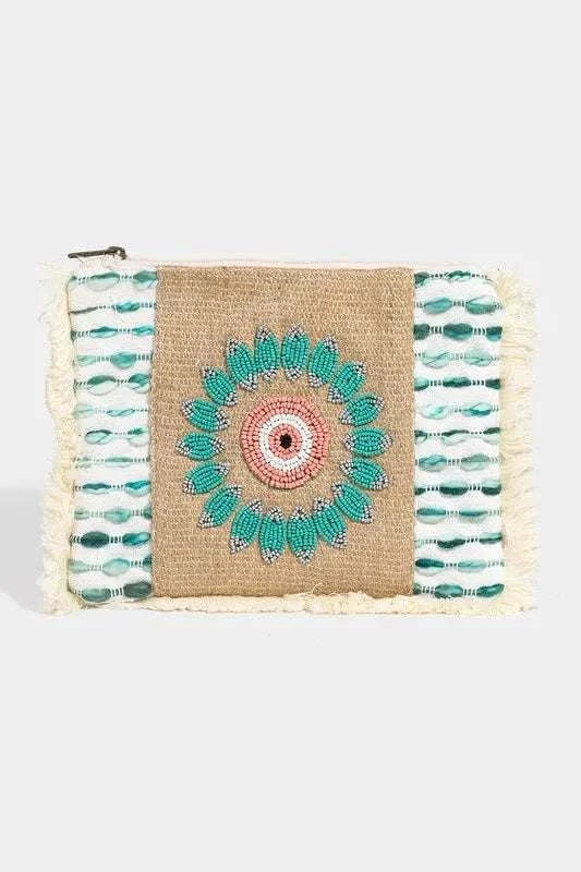 Fame Evil Eye Fringe Cosmetic BagThe Evil Eye Fringe Cosmetic Bag is a stylish and chic accessory featuring the iconic evil eye design and trendy fringe embellishments. This bag not only adds a fashMakeup BagsEvil Eye Fringe