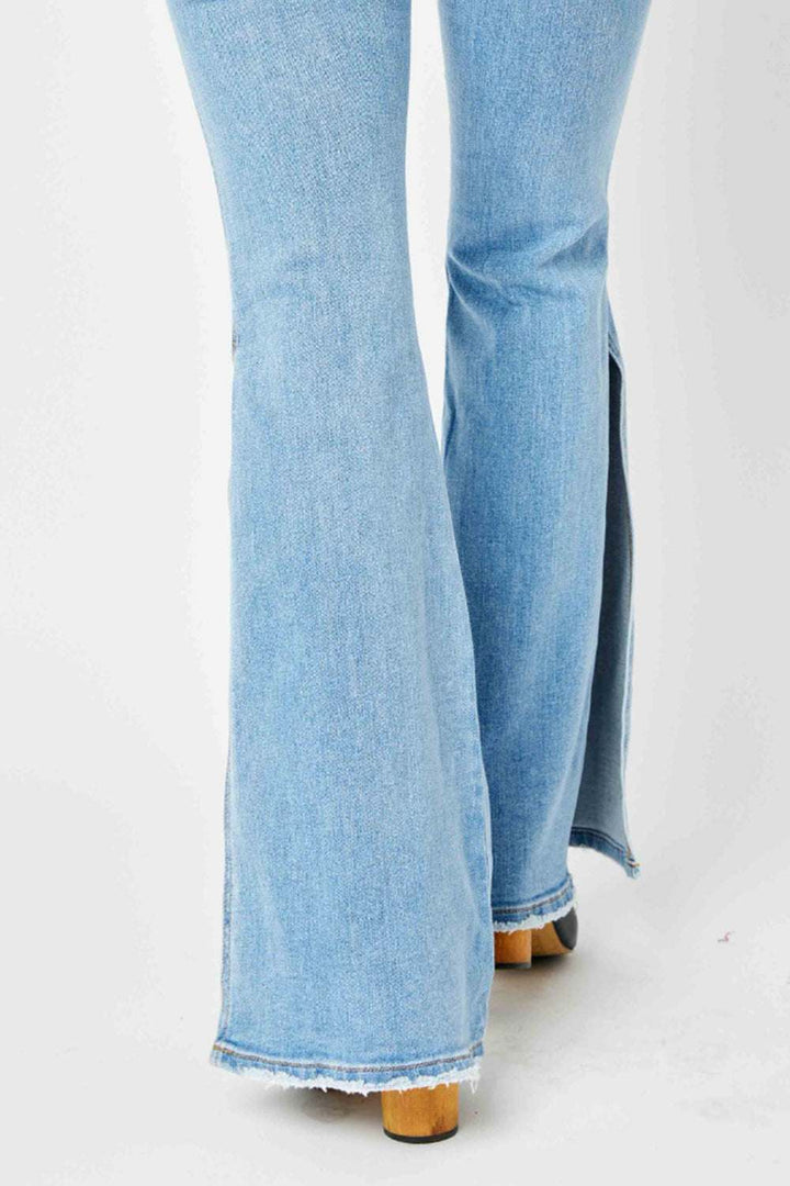 Judy Blue Mid Rise Raw Hem Slit Flare JeansThese jeans offer a flattering silhouette that hugs your curves in all the right places while providing a relaxed, retro-inspired flare at the hem. The versatile ligFlare JeansJudy Blue Mid Rise