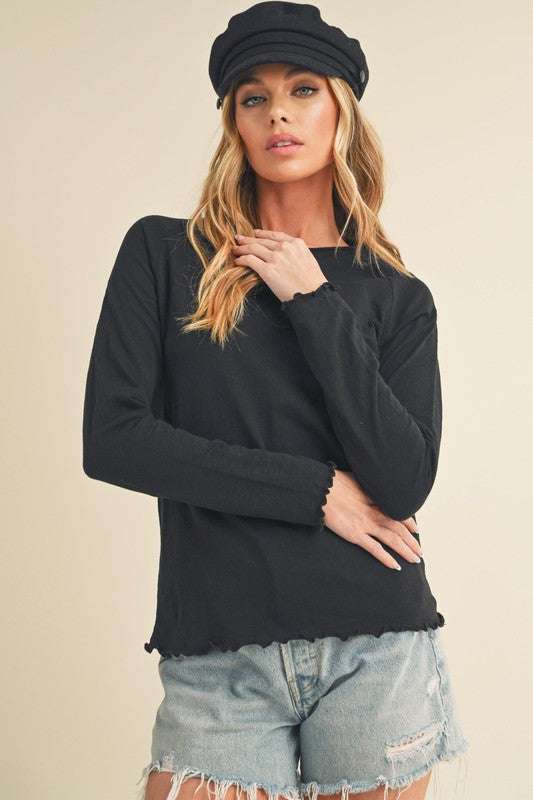 Cotton Lettuce Hem Long Sleeve T-ShirtThe Cotton Lettuce Hem Long Sleeve T-Shirt is a unique piece with a round neckline, raglan sleeves, and a lettuce hemline. This t-shirt features a fun and feminine dT-ShirtsCotton Lettuce Hem