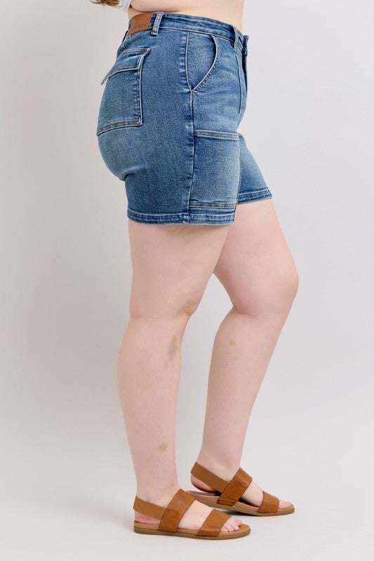 Judy Blue High Rise Denim ShortsHigh Rise Denim Shorts are a versatile and classic wardrobe staple that offer a stylish and flattering silhouette. These shorts sit at or above the natural waistlineJean ShortsJudy Blue High Rise Denim Shorts